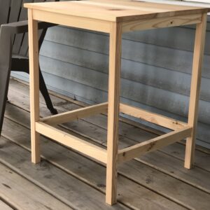 wooden end table on porch next to Adirondack chair