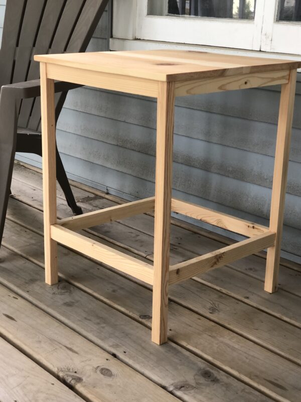 wooden end table on porch next to Adirondack chair